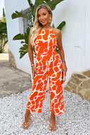 1735579082_Orange-Giraffe-Print-Strappy-Racer-Neck-Jumpsuit-1.jpg